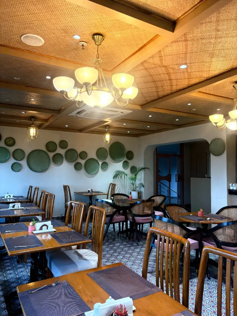 Main Dining Room — Warm light, woven ceilings and patterned floors